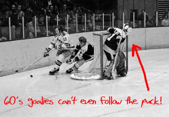 04 Jan 1974 --- Boston Bruins' Bobby Orr (4) forechecks Rangers' Bill Fairbairn (10) behind the Bruin net. --- Image by © Bettmann/CORBIS